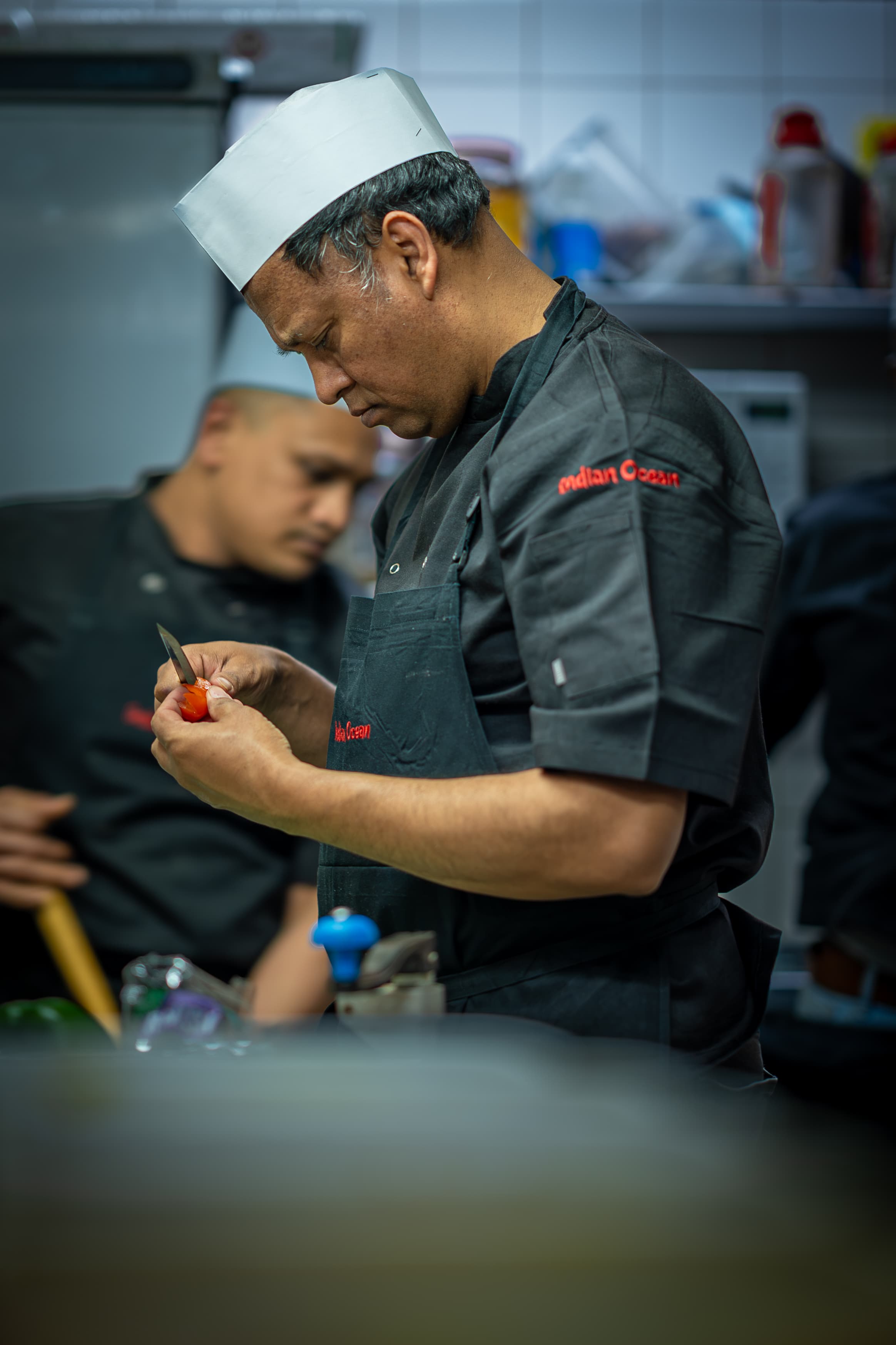 Chef in Indian Ocean uniform preparing ingredients
