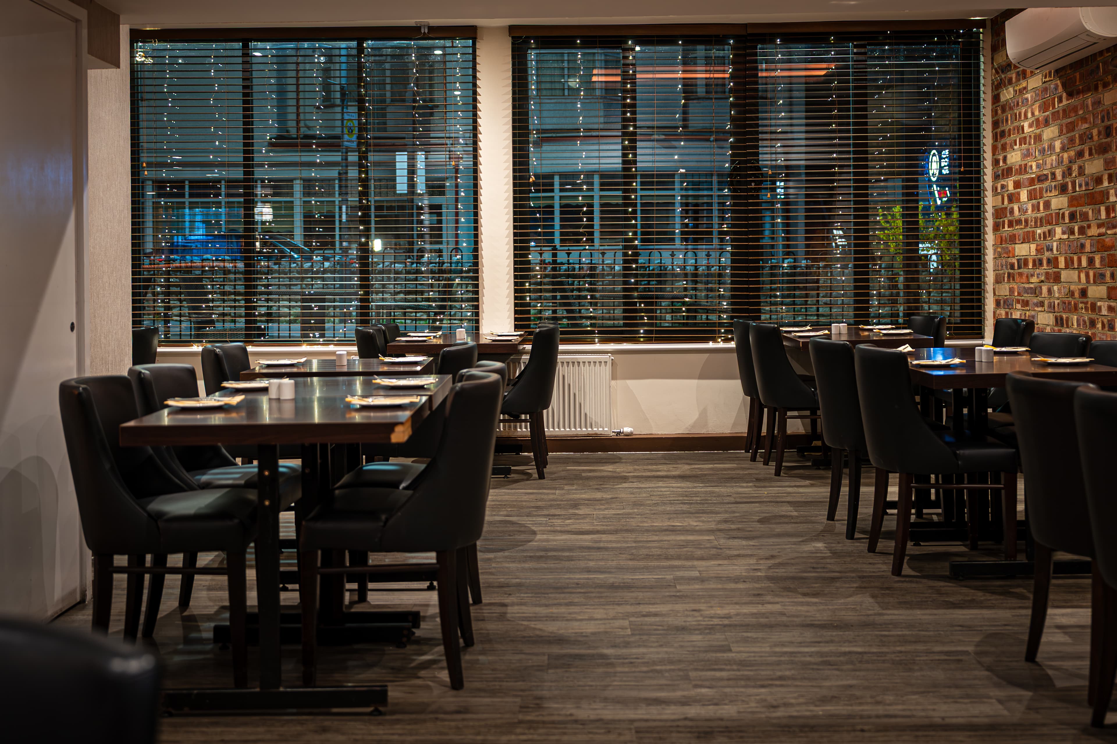 Evening dining room at Indian Ocean with fairy lights at the windows