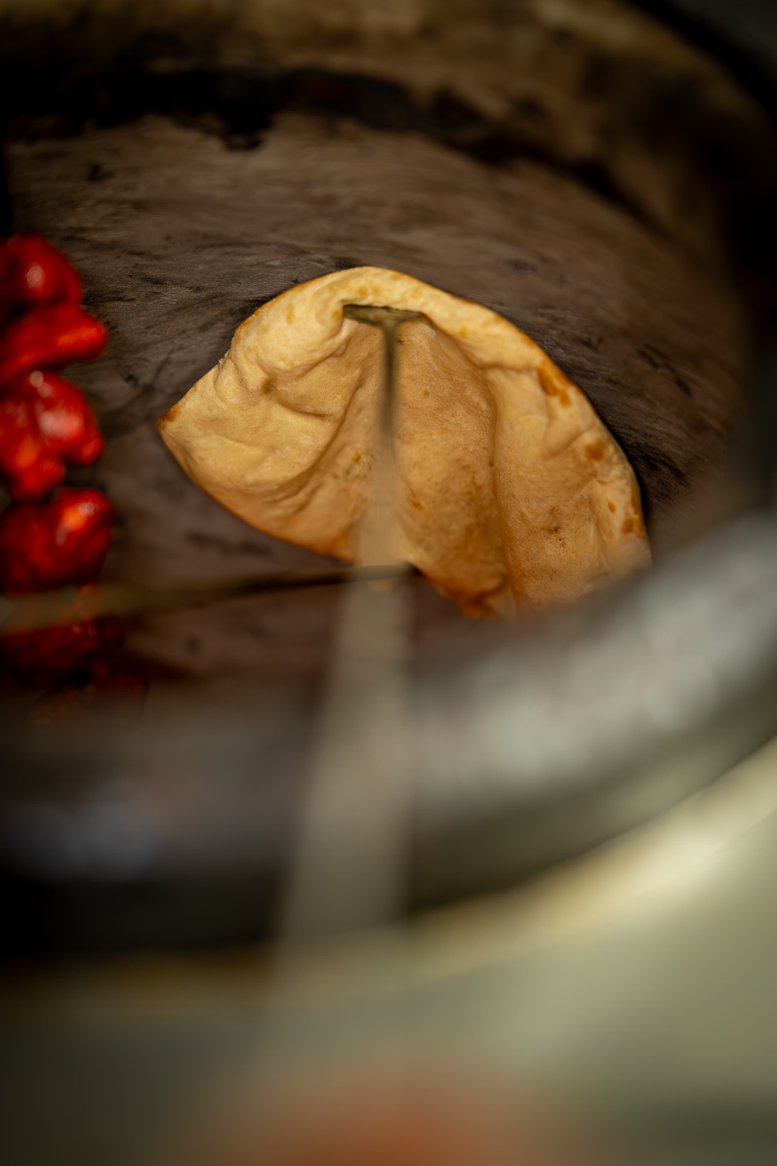 Naan bread sticking to the tandoor wall