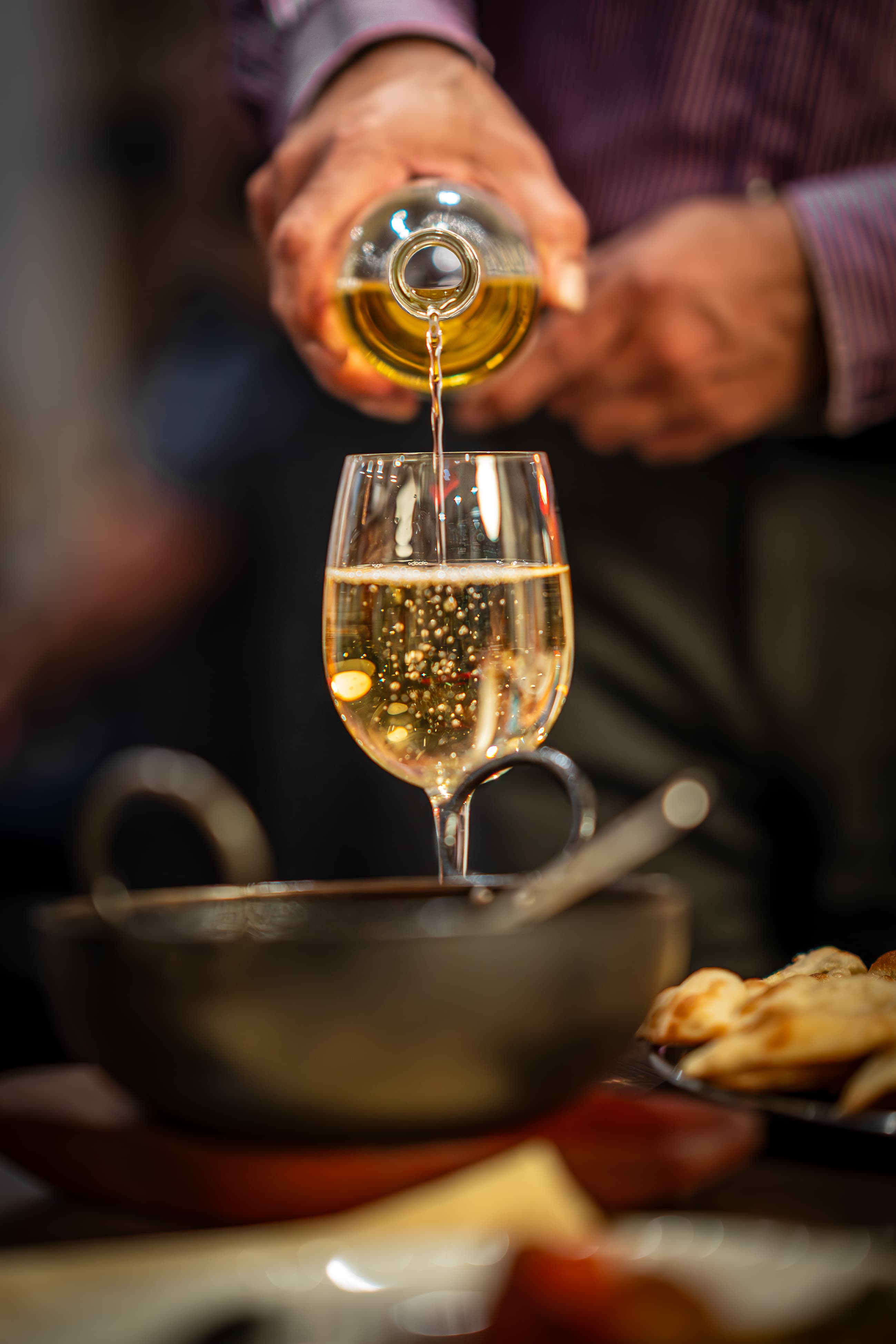 White wine being poured at the table